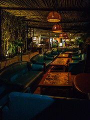 Contemporary Café Interior Design with Wooden Tables and Ambient Lighting .4K Photo