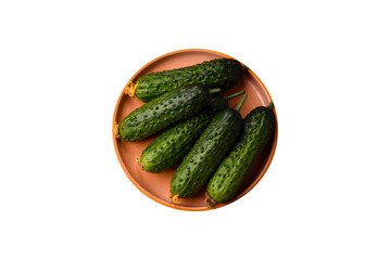 Fresh raw whole cucumbers, an ingredient for preparing salads and vegetarian dishes. Green fresh...