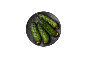 Fresh raw whole cucumbers, an ingredient for preparing salads and vegetarian dishes. Green fresh...