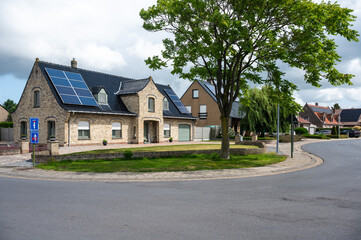 Detached residential houses in a green street in the village of Eernegem Ichtegem, West Flanders, Belgium