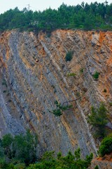 Picturesque panoramic landscape. Rock covered with wooded area. Wildlife. Jungle. Portugal. Background. Postcard. Poster