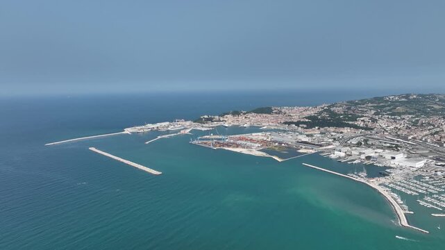 Large Passenger Vessel Moored at Italian Shipyard with Cranes and Warehouses