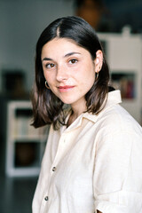 Young Woman With Medium-Length Hair in a Casual Indoor Setting During Daylight
