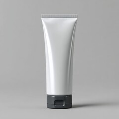 A clean white cosmetic tube with a dark grey flip top cap stands upright isolated on white background