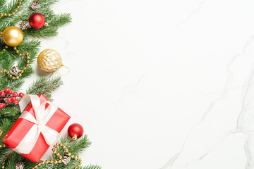 Christmas present with decor on white with space for design.
