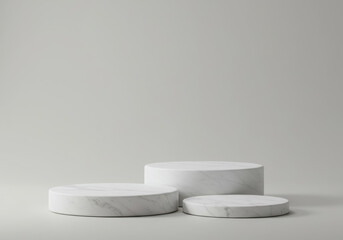 Three marble podiums are arranged on a light gray surface