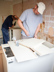 Kitchen Fitters: Flat Pack Carcass Construction. The early phase of building the carcass for a new...