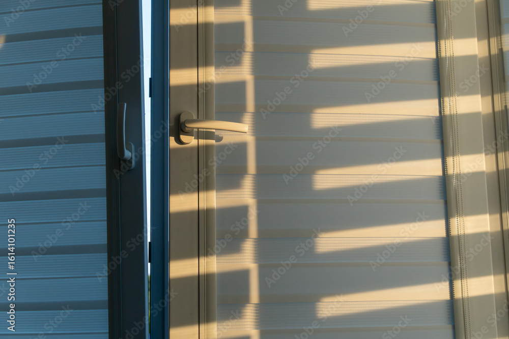 Aufkleber a door slightly ajar allows sunlight to create interesting shadow patterns on the wall. the soft ray