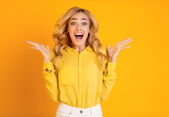 Excited Millennial Woman Screaming Over Yellow Background, Looking At Camera