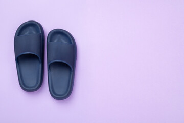 Blue sandals on color background,top view