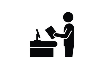 Black silhouette of a person holding a book standing next to a desk with a computer monitor