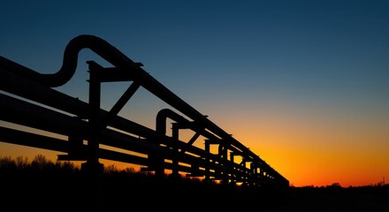 Industrial Pipeline Silhouette Against a Vibrant Sunset Sky, Energy Infrastructure