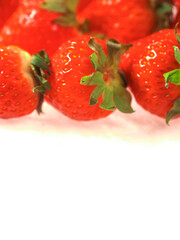 Fresh and juicy red strawberry on white background. Premium high quality organic product. Food supply industry. Close up details shot.