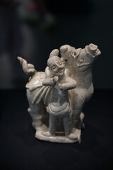 Blush white glazed figurine of Hu people leading a horse