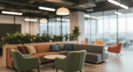 Blurred background of a modern office interior with a comfortable lounge area for collaboration or relaxation