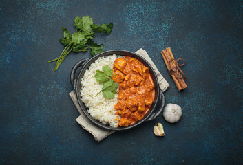 Indian chicken tikka masala in a creamy tomato sauce, served with basmati rice, fresh coriander and...