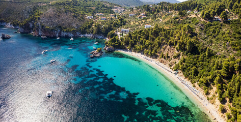 Best beaches of Greece.Sporades. Beautiful Skopelos island - Stafilos (Staphylos) with turquoise crystal sea surrounded by green hills. aerial drone panorama