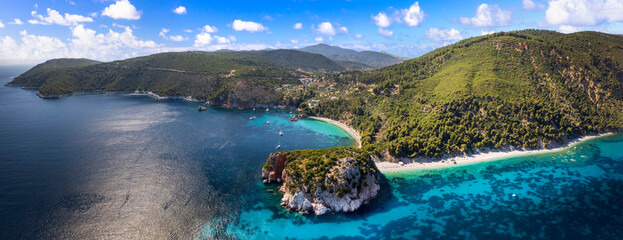 Best beaches of Greece.Sporades. Beautiful Skopelos island - Stafilos (Staphylos) and Velanio beach with turquoise crystal sea surrounded by green hills. aerial drone panorama
