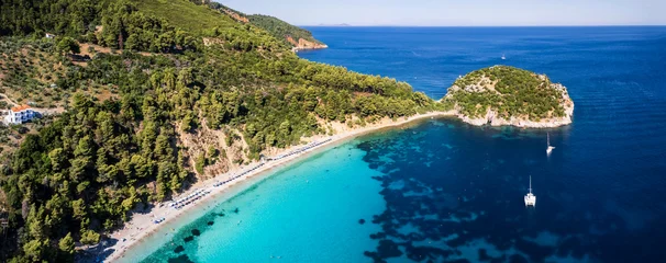 Gordijnen Best beaches of Greece. Sporades. Beautiful Skopelos island - Stafilos (Staphylos) with turquoise crystal sea surrounded by green hills. aerial drone panorama © Freesurf