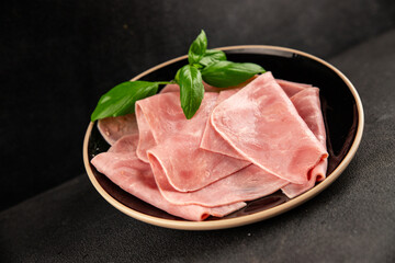 Ham slices meat spam pork fresh delicious gourmet food background on the table rustic food top view...