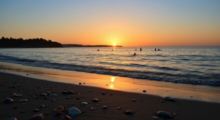 Golden Hour Serenity: Surfers Silhouetted Against a Vibrant Sunset at Pebble Beach