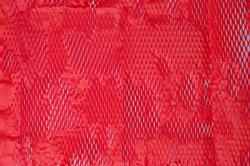 Red fabric texture background for design with copy space for text or image.