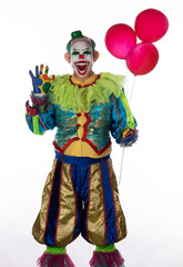 studio male portrait of evil clown on white background