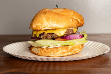 Cheeseburger with lettuce and tomato