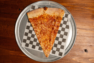 slice of large pizza on a tray