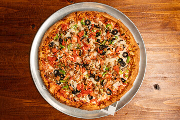 Deluxe pizza on a tray
