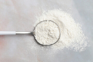 White powder in the spoon. Collagen protein powder or wheat flour. Concept of nutritional supplement, dieting, detox, preventive healthcare and healthy lifestyle.	
