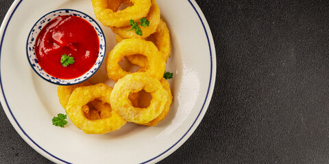 Colmar rings fried food fries fast food crispy appetizer fresh delicious gourmet food background on the table rustic food top view copy space
