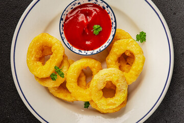 Colmar rings fried food fries fast food crispy appetizer fresh delicious gourmet food background on...