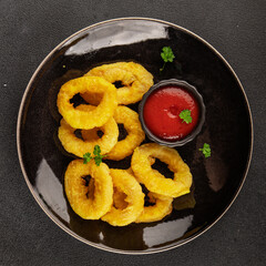 Colmar rings fried food fries fast food crispy appetizer fresh delicious gourmet food background on the table rustic food top view copy space