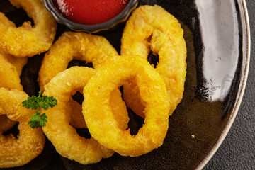 Colmar rings fried food fries fast food crispy appetizer fresh delicious gourmet food background on...
