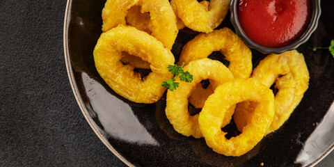 Colmar rings fried food fries fast food crispy appetizer fresh delicious gourmet food background on the table rustic food top view copy space