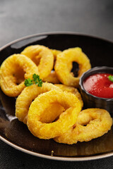 Colmar rings fried food fries fast food crispy appetizer fresh delicious gourmet food background on the table rustic food top view copy space