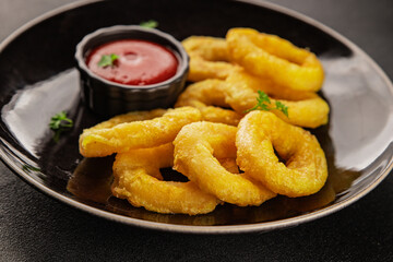 Colmar rings fried food fries fast food crispy appetizer fresh delicious gourmet food background on...