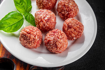 Meatballs raw meat pork, beef, chicken fresh delicious gourmet food background on the table rustic...
