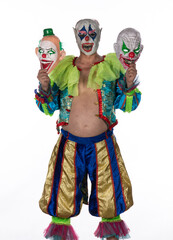 studio male portrait of evil clown on white background