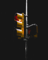 Snow-Covered Traffic Light with Red Signal and Walk Sign in Winter Storm