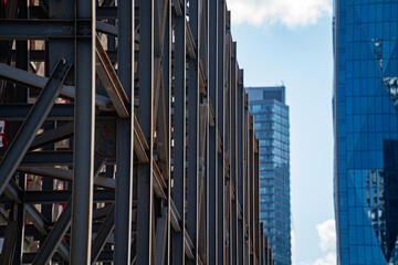 View of skyscraper construction in downtown area.