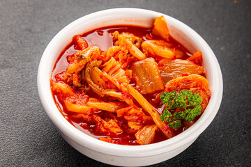 Kimchi pickled cabbage salad spicy savory vegetables fresh delicious gourmet food background on the table rustic food top view copy space vegetarian and vegan food