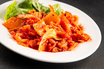 Kimchi pickled cabbage salad spicy savory vegetables fresh delicious gourmet food background on the table rustic food top view copy space vegetarian and vegan food