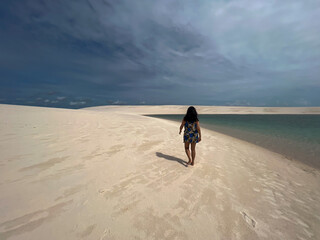 Brazil, Barreirinhas- 2023, May: woman walking on the lençóis maranhenses 