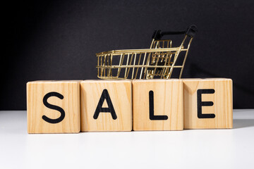 A conceptual setup featuring wooden cubes spelling 