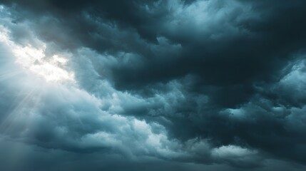 Dramatic clouds with sunbeams piercing through.