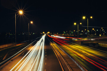Night Traffic Trails on a Highway, Cars Moving in Both Directions with Long Exposure