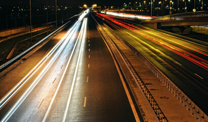 Night Traffic Trails on a Highway, Cars Moving in Both Directions with Long Exposure