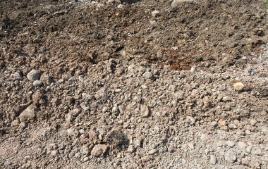 The texture of clay from the mountains used to fill rice fields to make flat, solid land for building foundations can be used as a background image for a banner design.